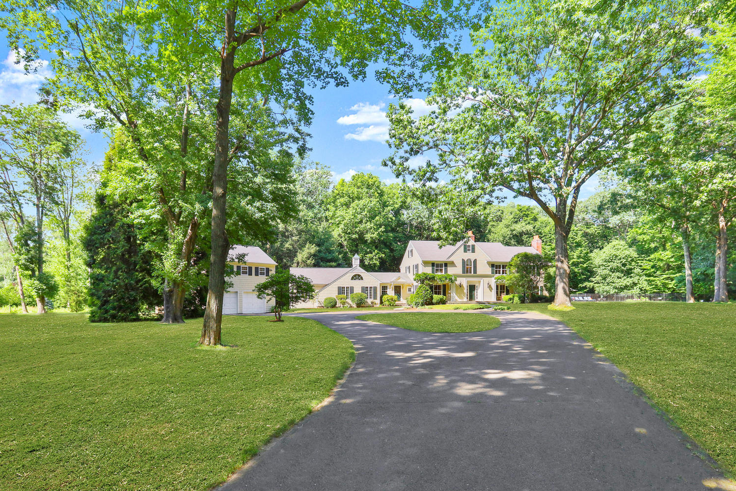 298 Brookside Road Darien, CT 06820 - Photo 31 of 36 a front view of a house with a yard