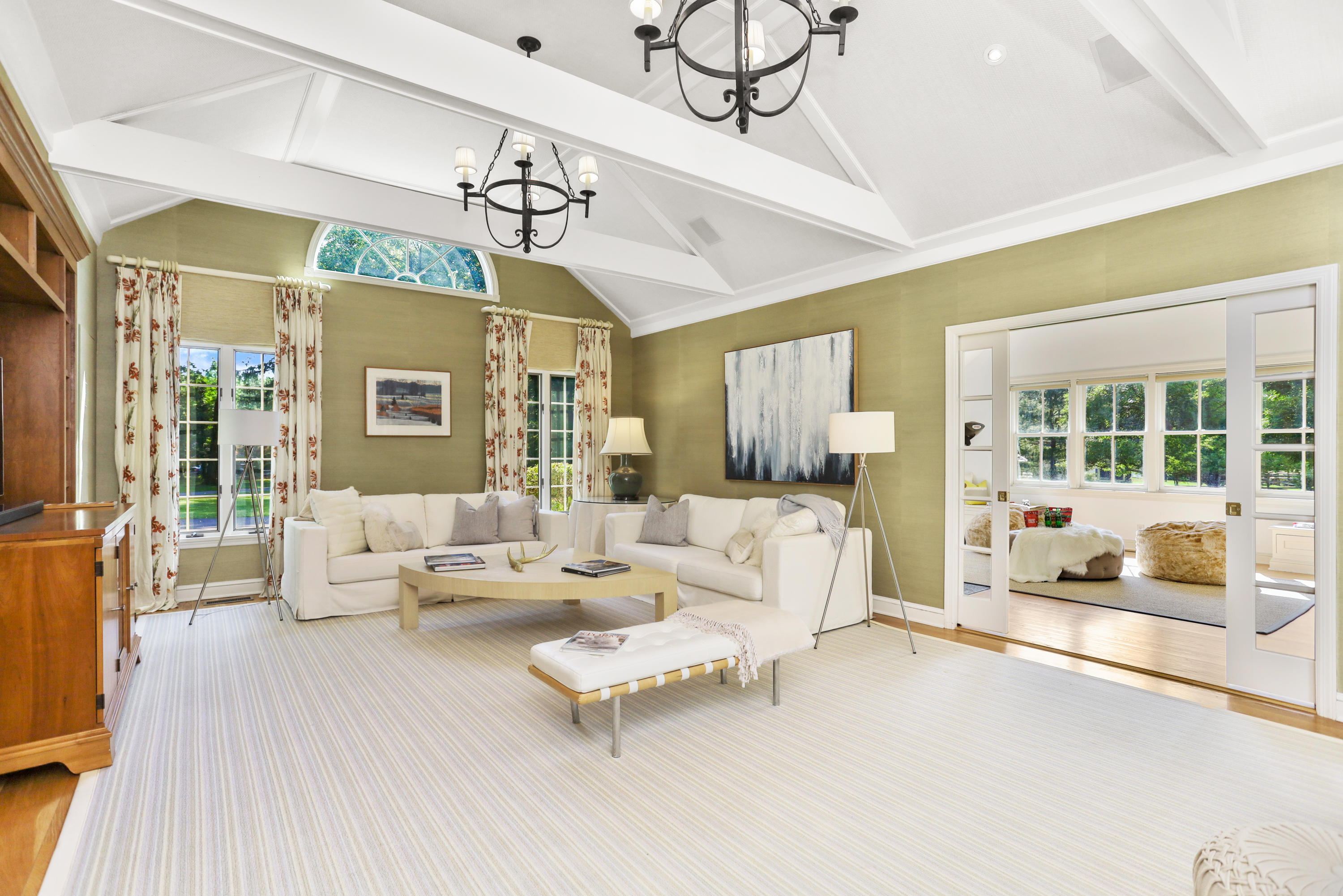298 Brookside Road Darien, CT 06820 - Photo 8 of 36 a living room with furniture and a chandelier