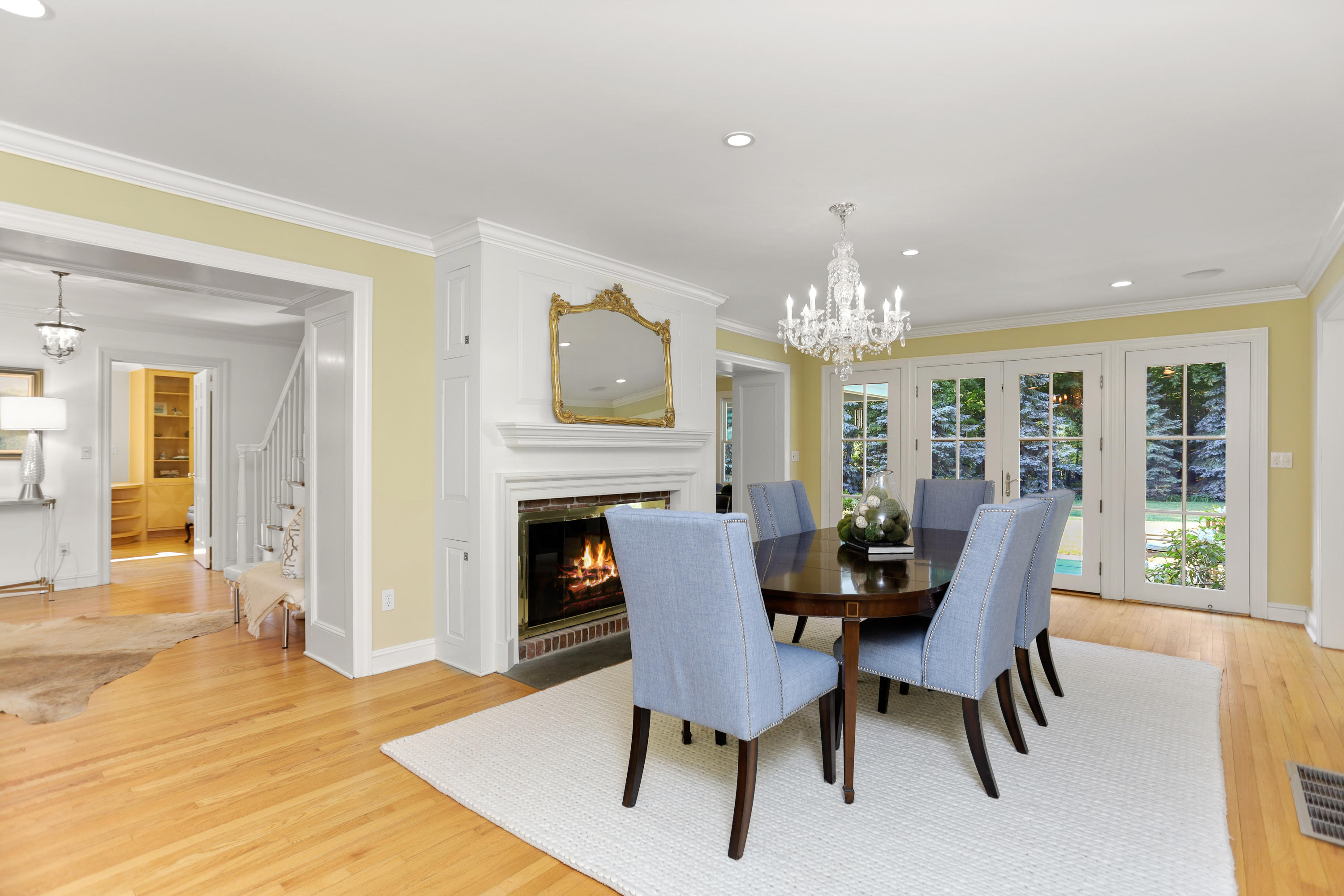298 Brookside Road Darien, CT 06820 - Photo 10 of 36 a view of a dining room with furniture a chandelier and wooden floor