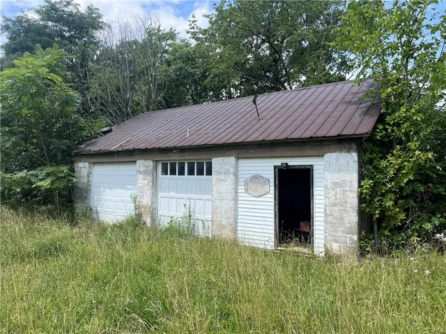 a view of a backyard of the house