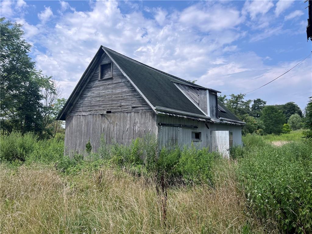 659 Alexander Road Latrobe, PA 15650 - Photo 10 of 15 a backyard of a house with lots of green space