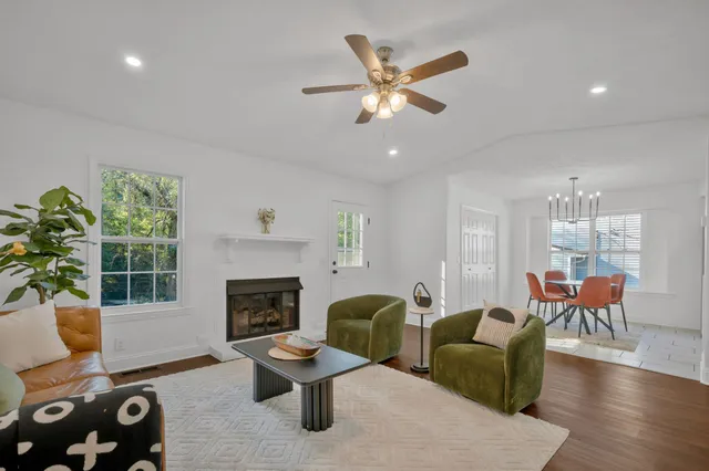 a dining room with furniture and kitchen view