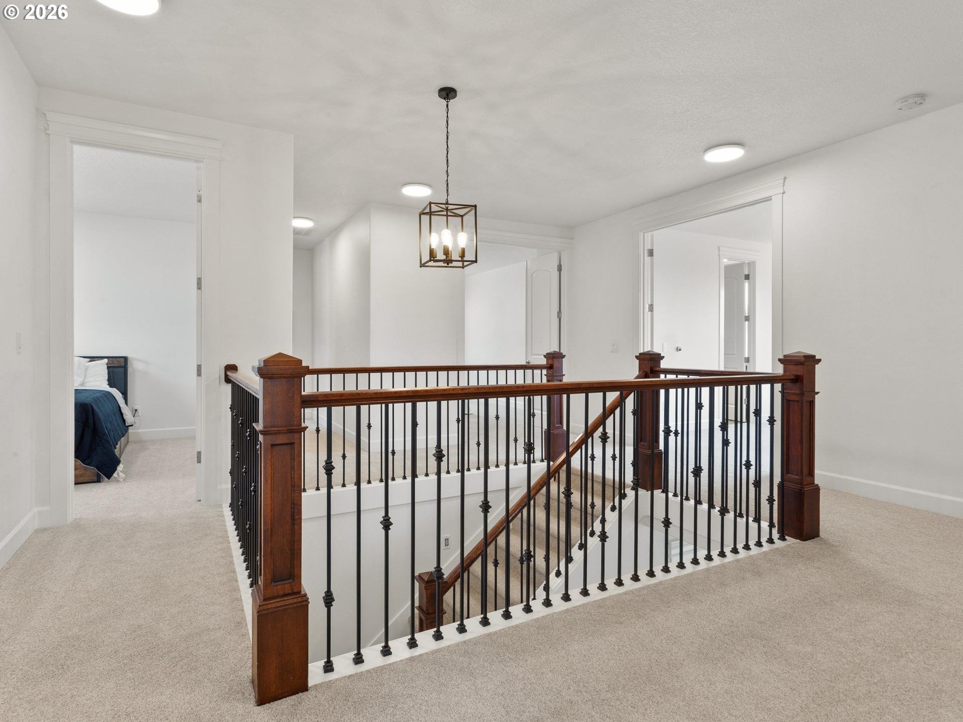 1012 Northwest Goodwin Street Camas, WA 98607 - Photo 30 of 44 a view of a hallway with a chandelier