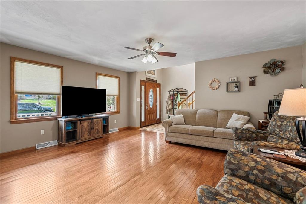 172 Valley Fields Drive Pittsburgh, PA 15239 - Photo 13 of 41 a living room with furniture and a flat screen tv