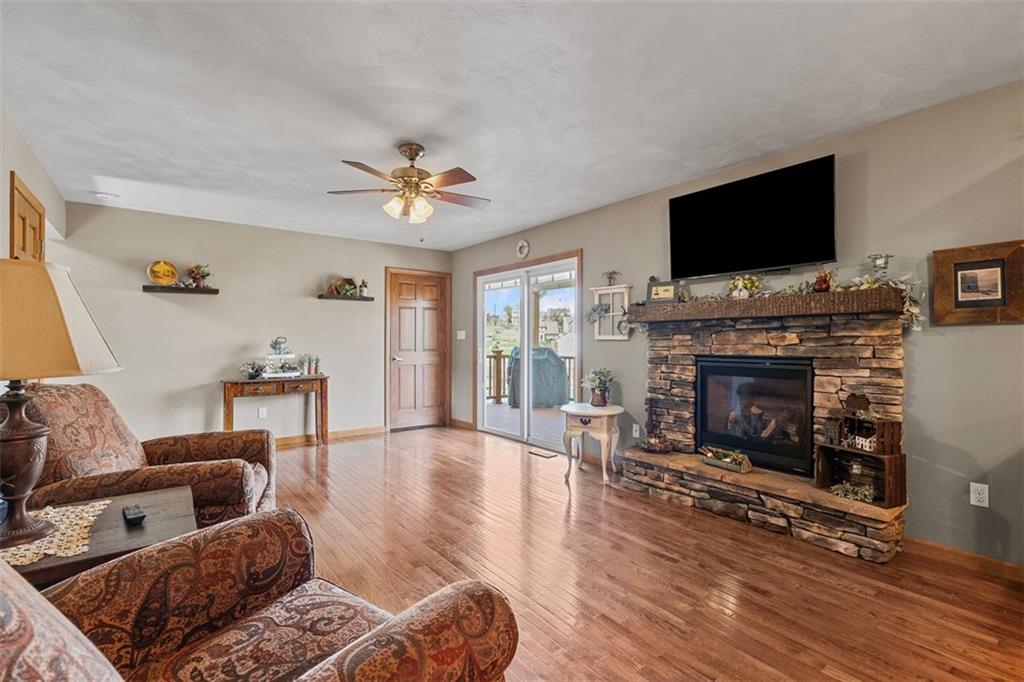 172 Valley Fields Drive Pittsburgh, PA 15239 - Photo 19 of 41 a living room with furniture a flat screen tv and a fireplace