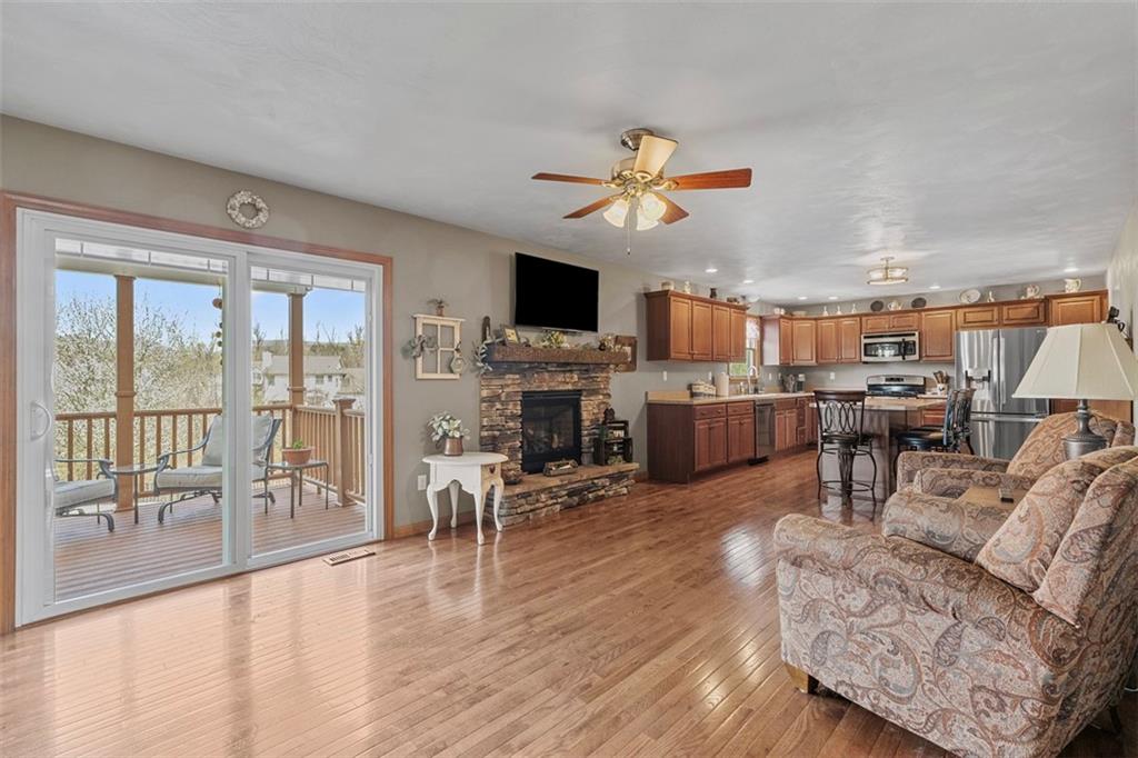 172 Valley Fields Drive Pittsburgh, PA 15239 - Photo 20 of 41 a living room with furniture a fireplace and a flat screen tv