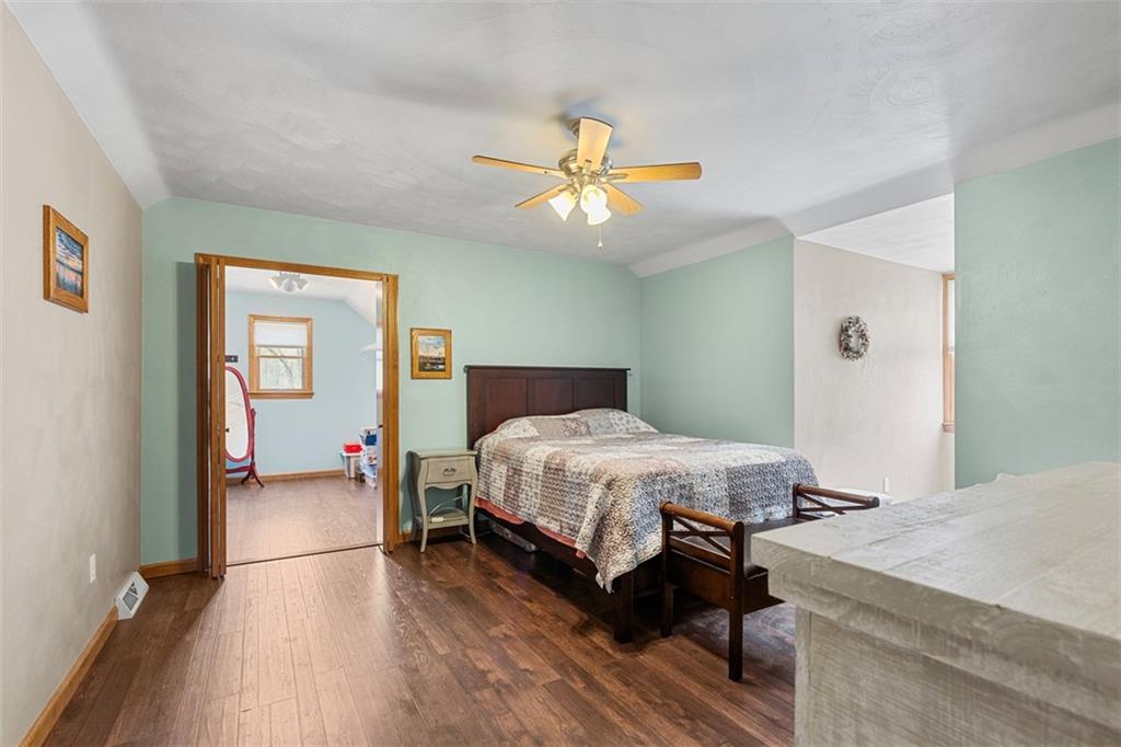 172 Valley Fields Drive Pittsburgh, PA 15239 - Photo 23 of 41 a bedroom with a bed and a chandelier