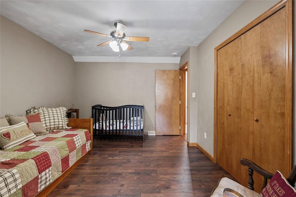 172 Valley Fields Drive Pittsburgh, PA 15239 - Photo 29 of 41 a bedroom with a bed and wooden floor