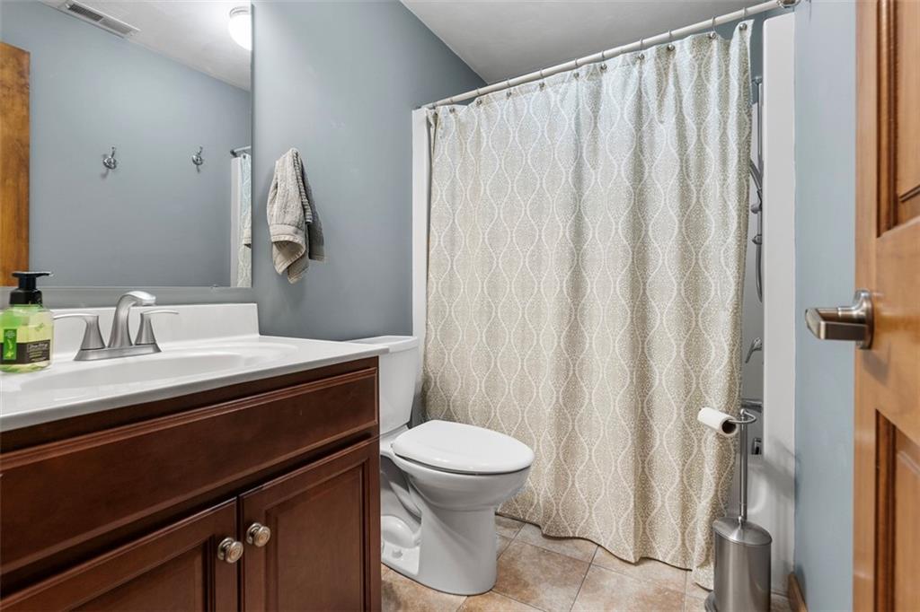 172 Valley Fields Drive Pittsburgh, PA 15239 - Photo 33 of 41 a bathroom with a sink a toilet and shower