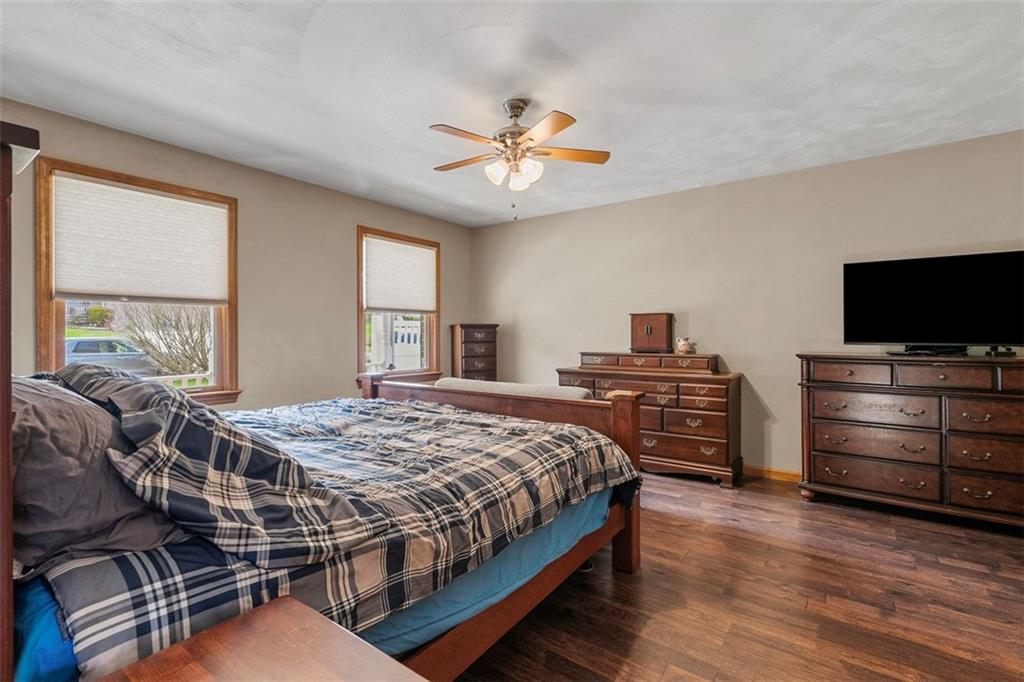 172 Valley Fields Drive Pittsburgh, PA 15239 - Photo 5 of 41 a bedroom with a bed and wooden floor