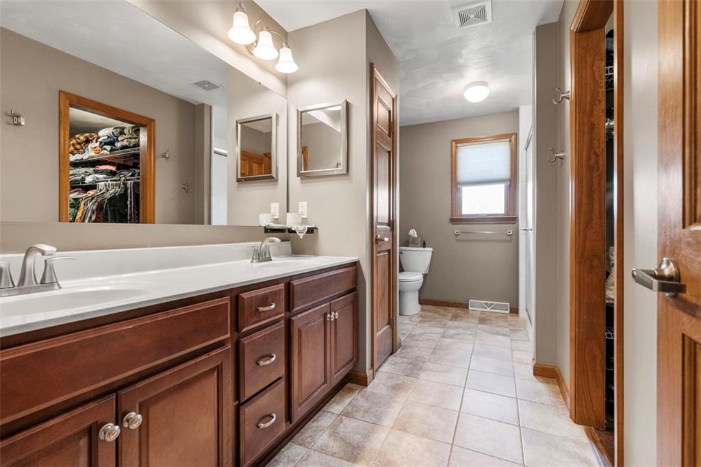 172 Valley Fields Drive Pittsburgh, PA 15239 - Photo 6 of 41 a spacious bathroom with a double vanity sink and a mirror