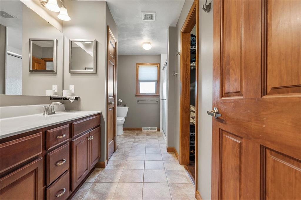 172 Valley Fields Drive Pittsburgh, PA 15239 - Photo 9 of 41 a bathroom with a double vanity sink and mirror