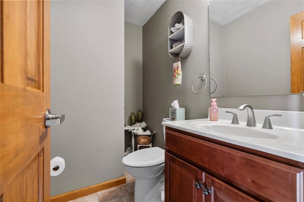 172 Valley Fields Drive Pittsburgh, PA 15239 - Photo 10 of 41 a bathroom with a sink a toilet and mirror