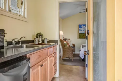 a en suite bathroom with a sink double vanity and a mirror
