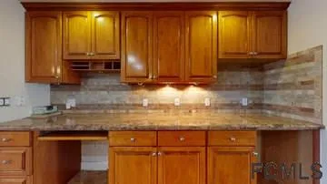a kitchen with sink cabinets and window