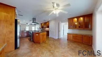a view of living room with furniture and a flat screen tv