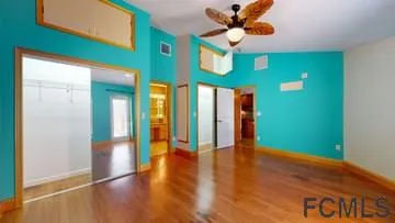 a view of an entryway with wooden floor