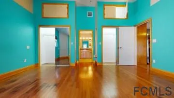 a view of an entryway with wooden floor
