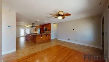 a view of kitchen and dining room with wooden floor