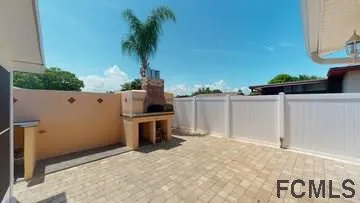 a view of a kitchen with a sink and a window