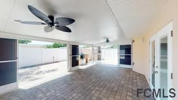 an aerial view of a house with a yard and lake view
