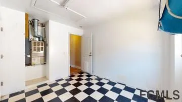 a black and white checkered floor with a black white and white wall
