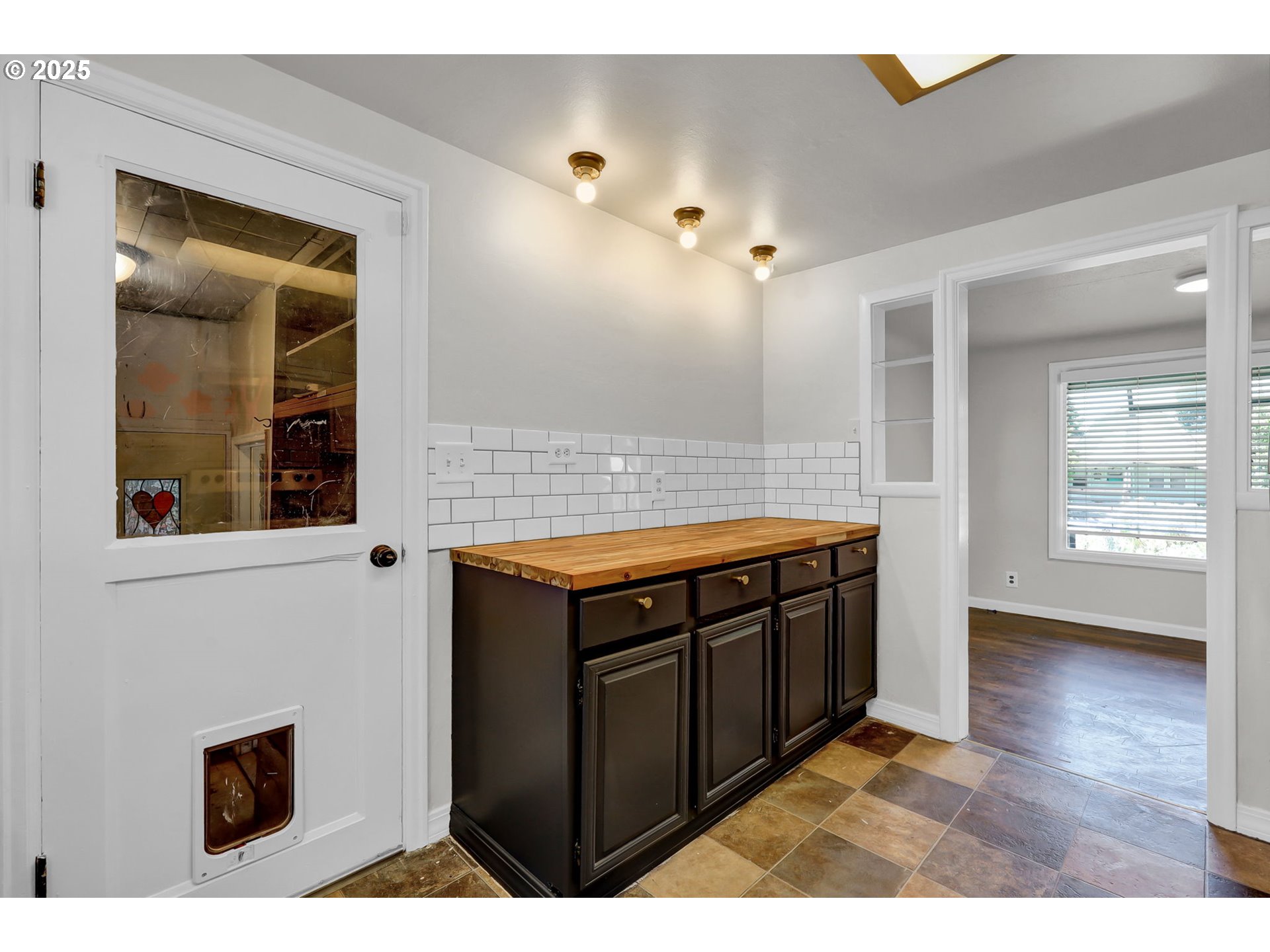 1119 7th Street Springfield, OR 97477 - Photo 18 of 43 a kitchen with stainless steel appliances granite countertop a stove a sink and a microwave