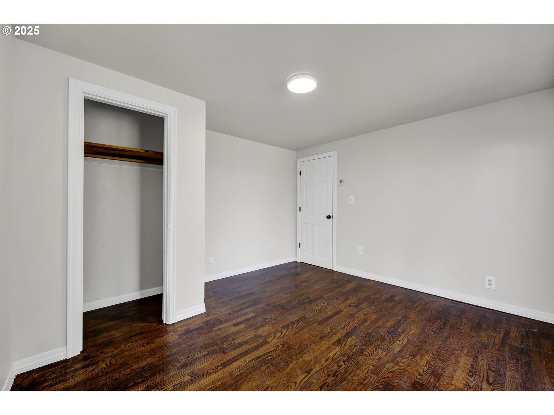 1119 7th Street Springfield, OR 97477 - Photo 26 of 43 a view of an empty room with wooden floor