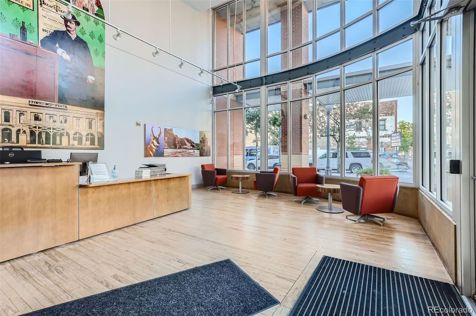 1499 Blake Street, Unit 5I Denver, CO 80202 - Photo 23 of 28 a living room filled with furniture and a large window