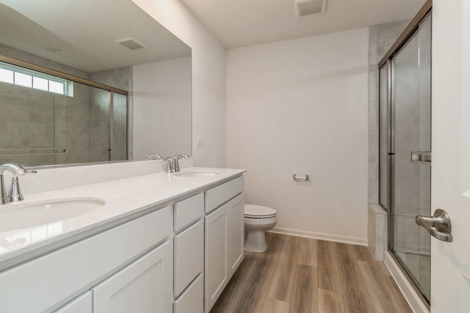 25624 West Springview Drive Plainfield, IL 60586 - Photo 11 of 22 a bathroom with a sink a toilet and a mirror