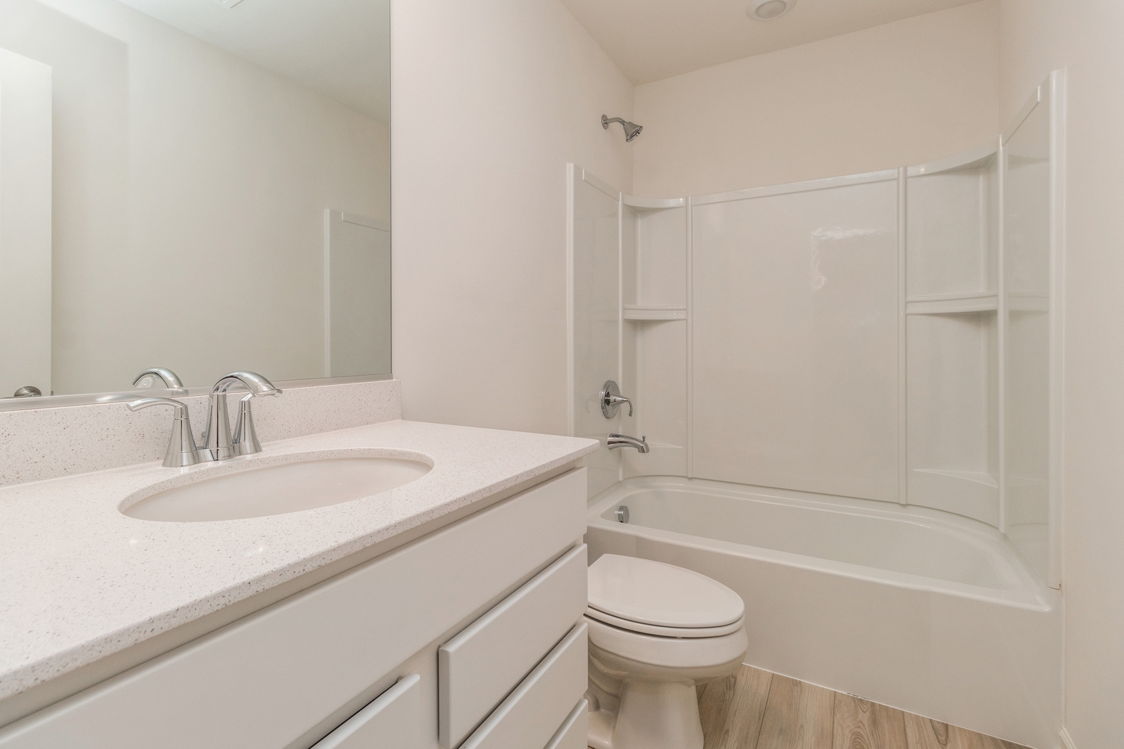 25624 West Springview Drive Plainfield, IL 60586 - Photo 12 of 22 a bathroom with a sink a toilet and shower
