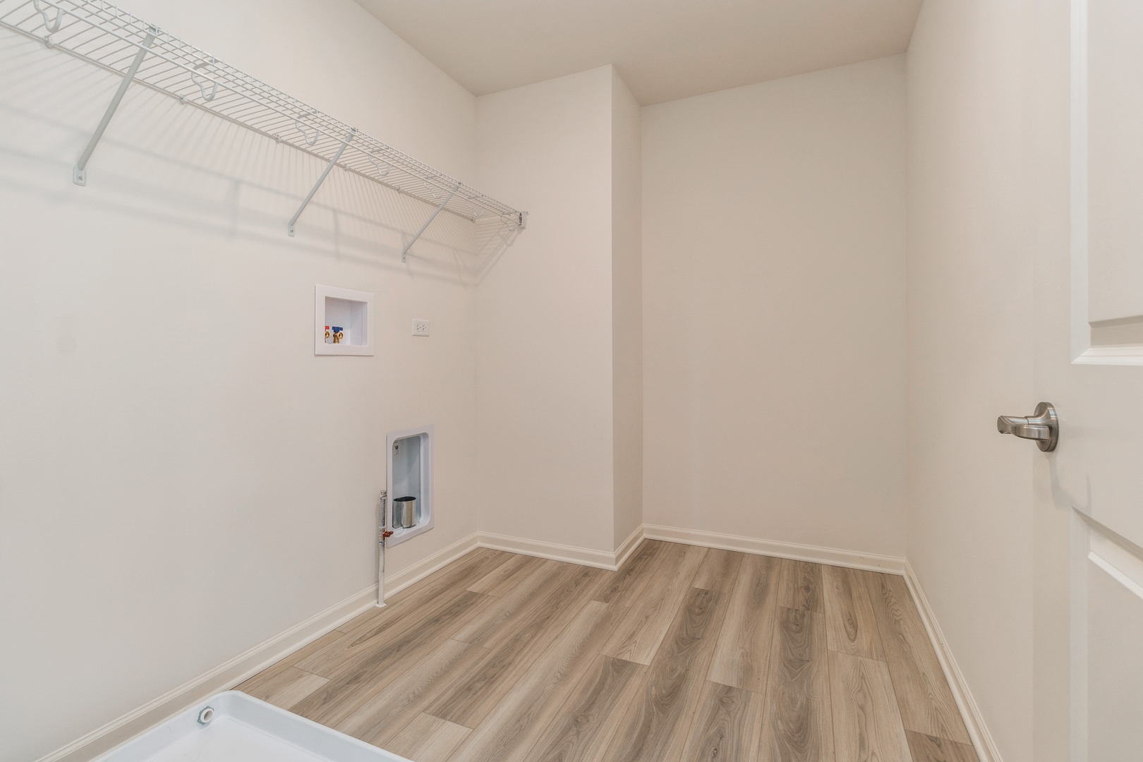 25624 West Springview Drive Plainfield, IL 60586 - Photo 13 of 22 a view of a room with racks on the wall