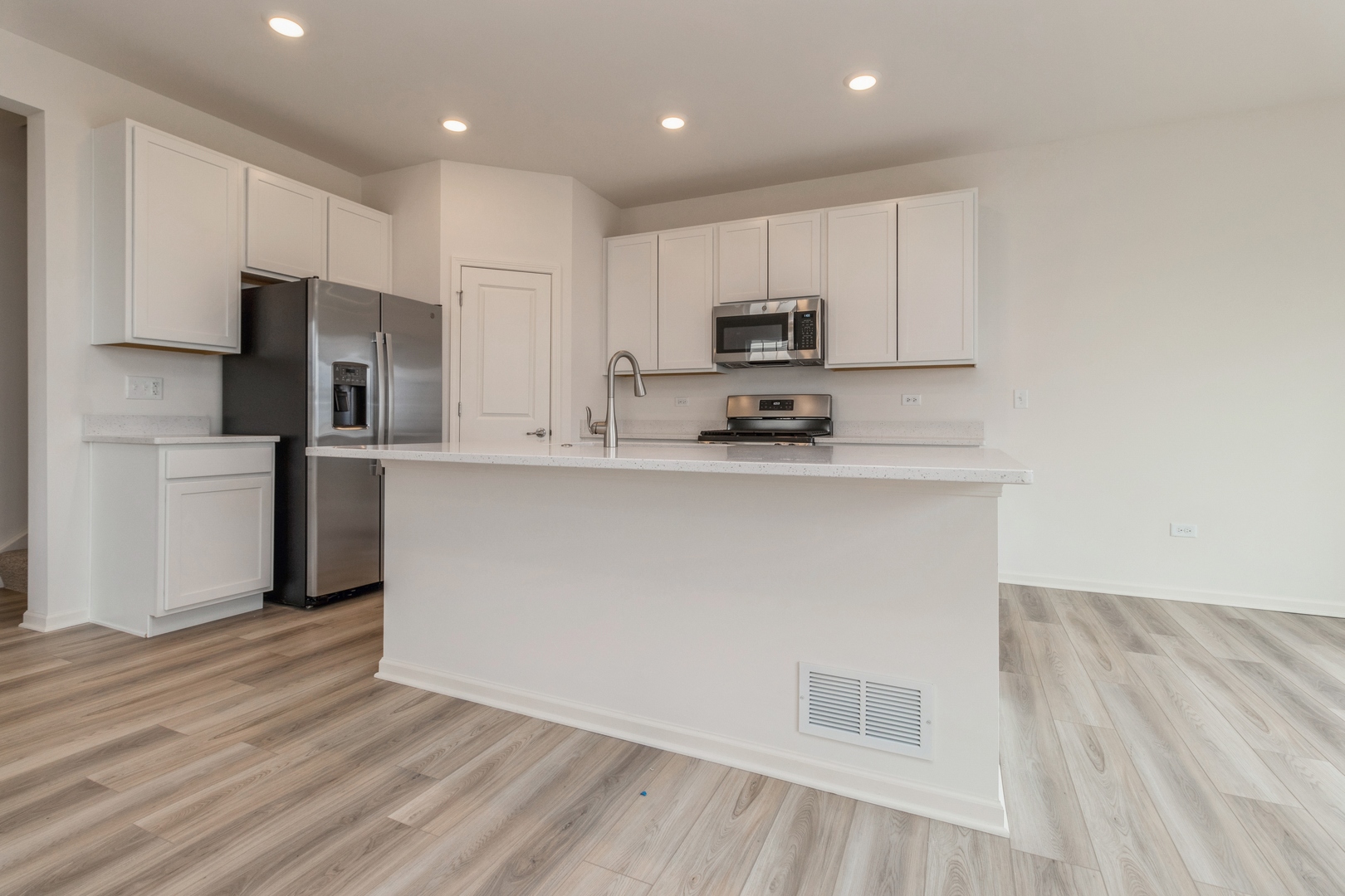 25624 West Springview Drive Plainfield, IL 60586 - Photo 3 of 22 a kitchen with stainless steel appliances a refrigerator sink and microwave