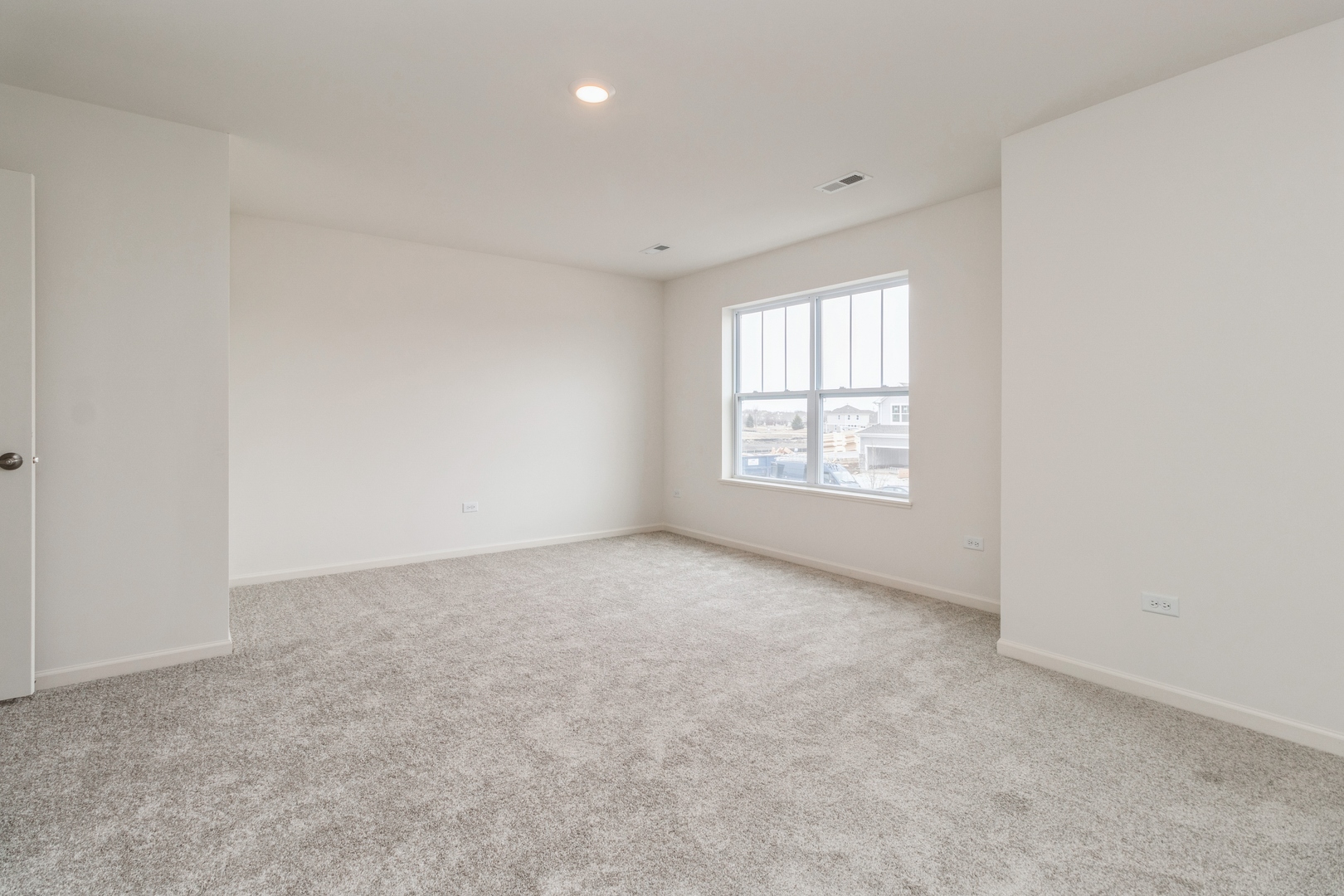 25624 West Springview Drive Plainfield, IL 60586 - Photo 9 of 22 an empty room with windows