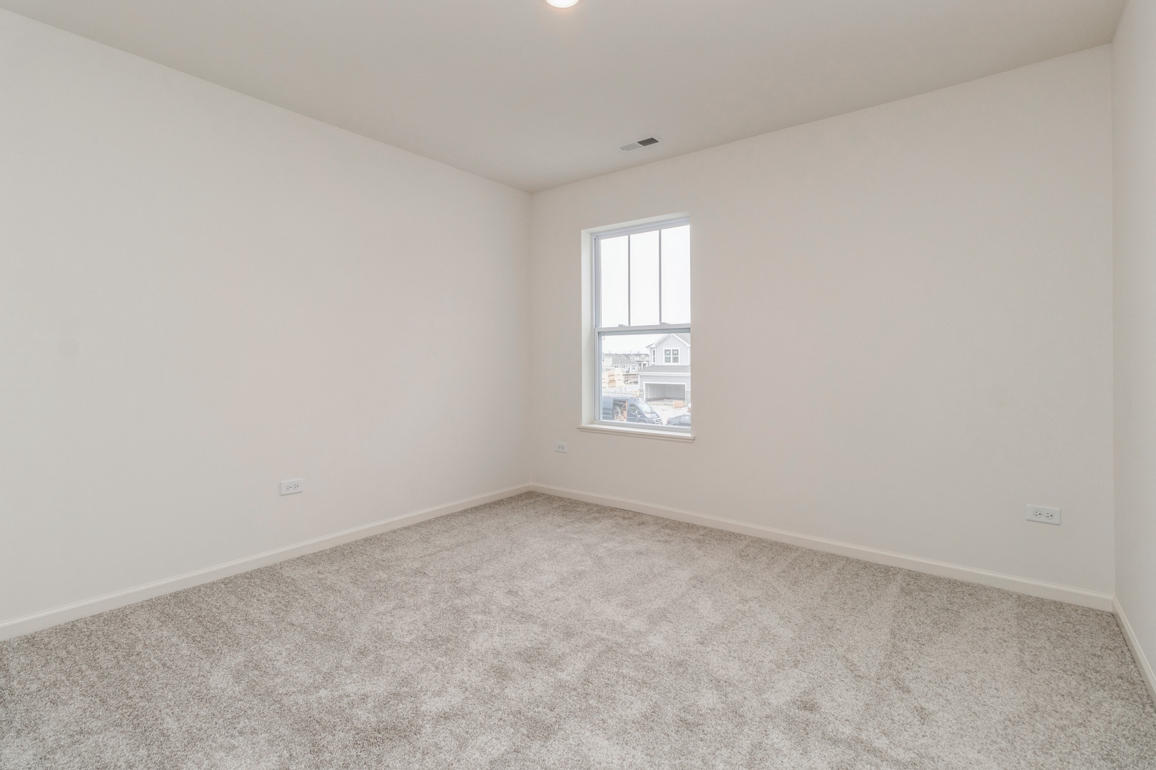 25624 West Springview Drive Plainfield, IL 60586 - Photo 10 of 22 an empty room with windows