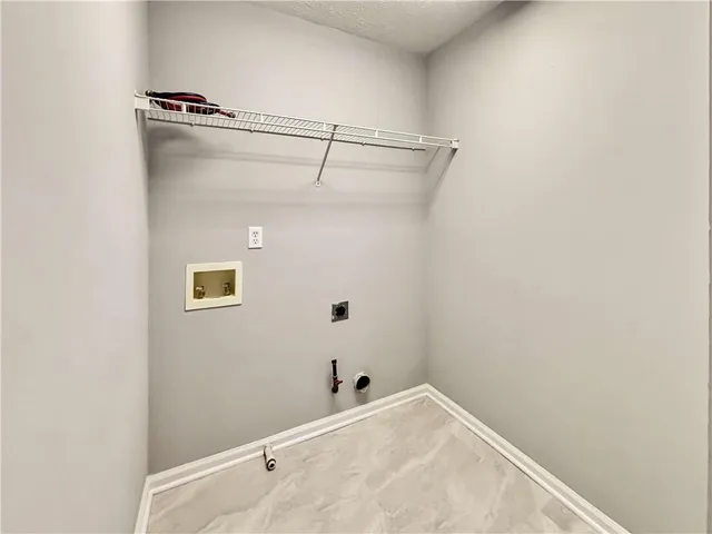 a bathroom with a shower and a white bath tub