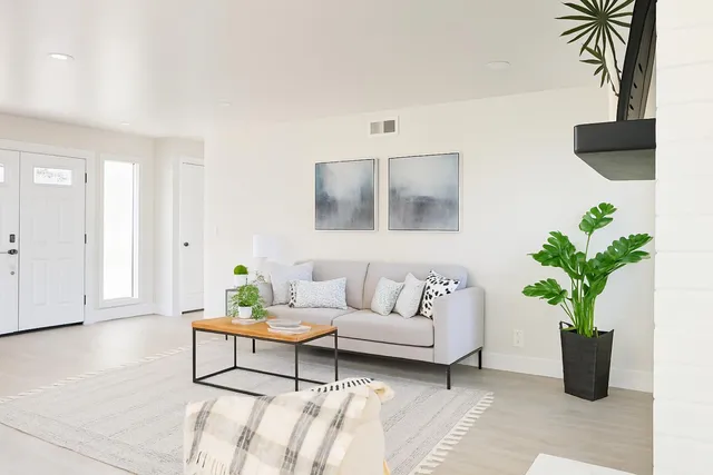 a bedroom with a bed and chair