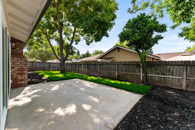 a backyard of a house with lots of green space