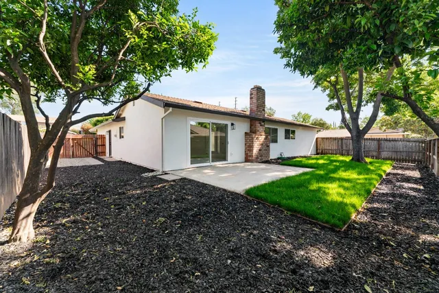 a backyard of a house with lots of green space