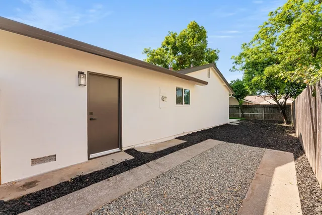 a outdoor living space with patio furniture and garden