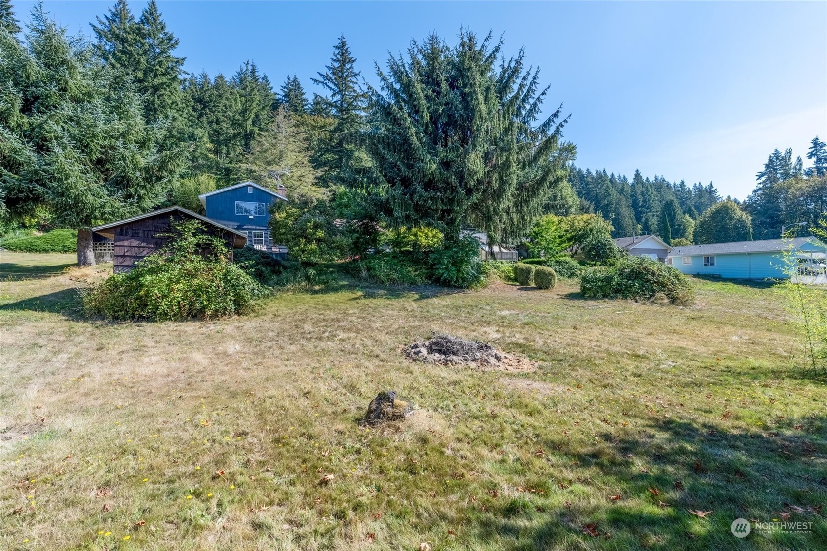 3827 Sunset Way Longview, WA 98632 - Photo 39 of 40 a view of a garden with a fountain
