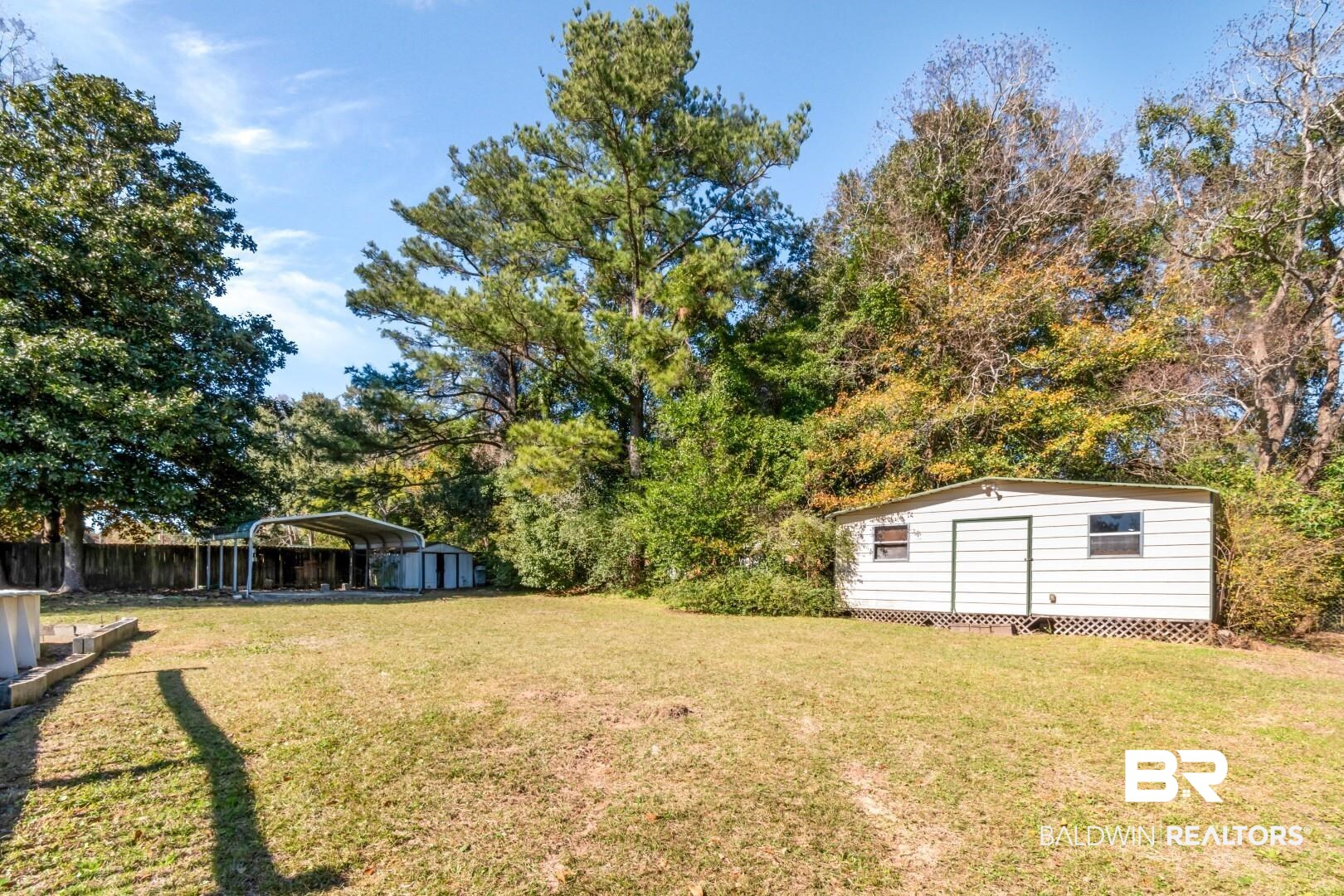 8304 Champlain Circle Mobile, AL 36695 - Photo 35 of 46 View of yard with a carport and a storage unit