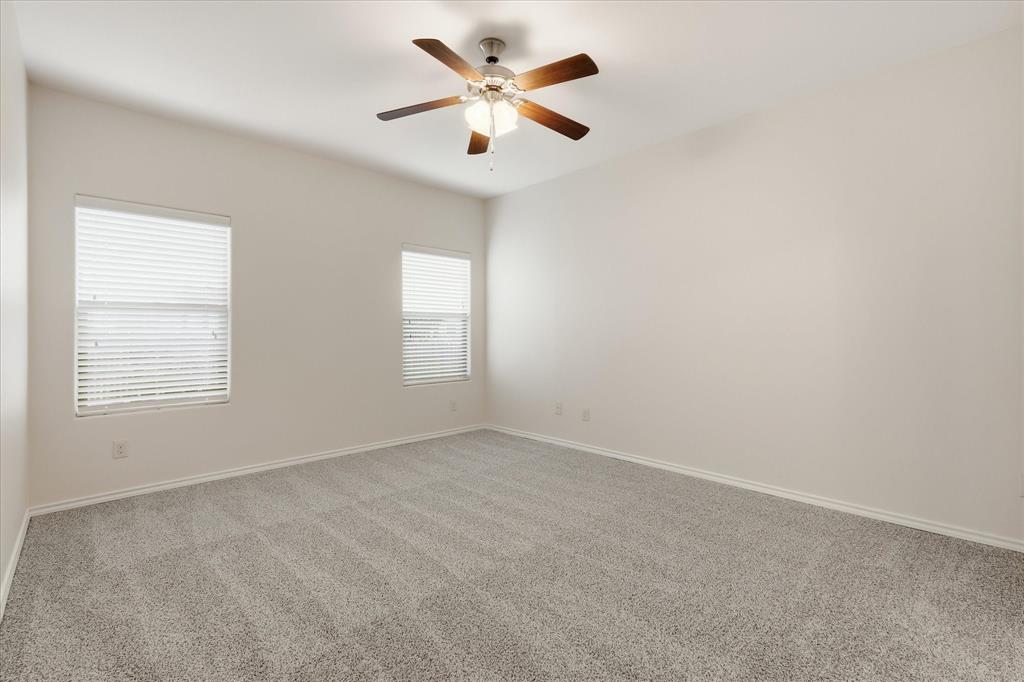 720 Rio Bravo Drive Fort Worth, TX 76052 - Photo 20 of 38 Spacious room featuring vaulted ceilings and a ceiling fan with light fixture