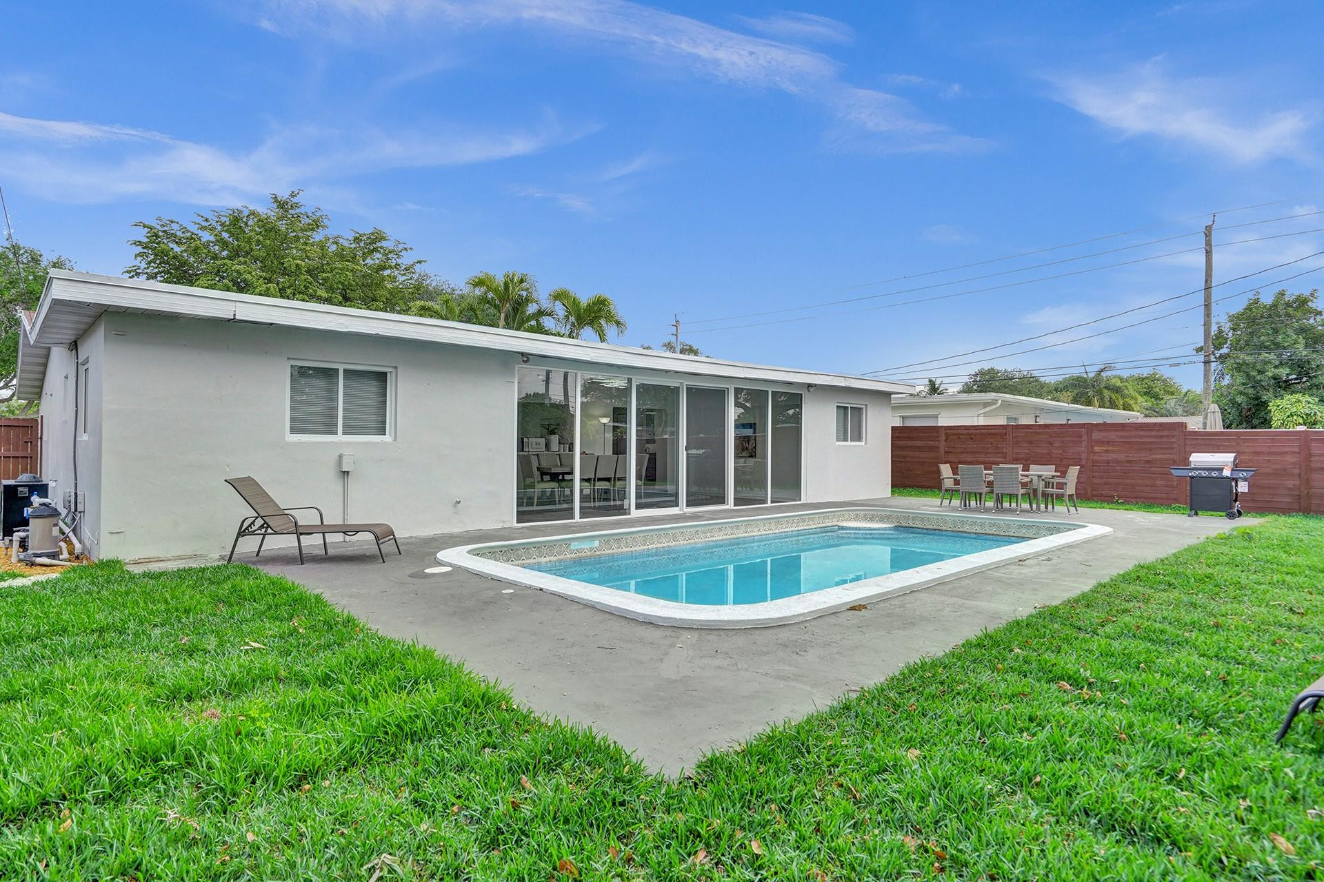 2114 North 42nd Avenue Hollywood, FL 33021 - Photo 22 of 24 a front view of house with yard and outdoor seating
