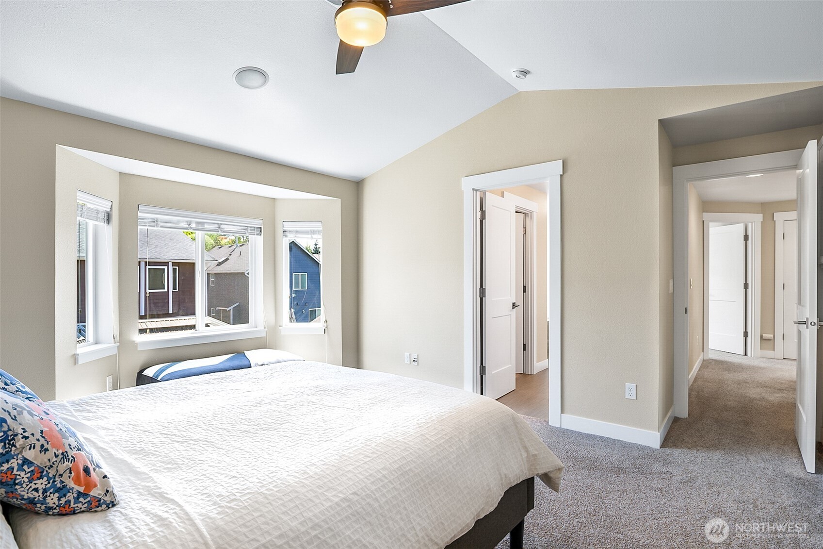 708 Rosario Place Northeast Renton, WA 98059 - Photo 23 of 38 a bedroom with a bed and a large window