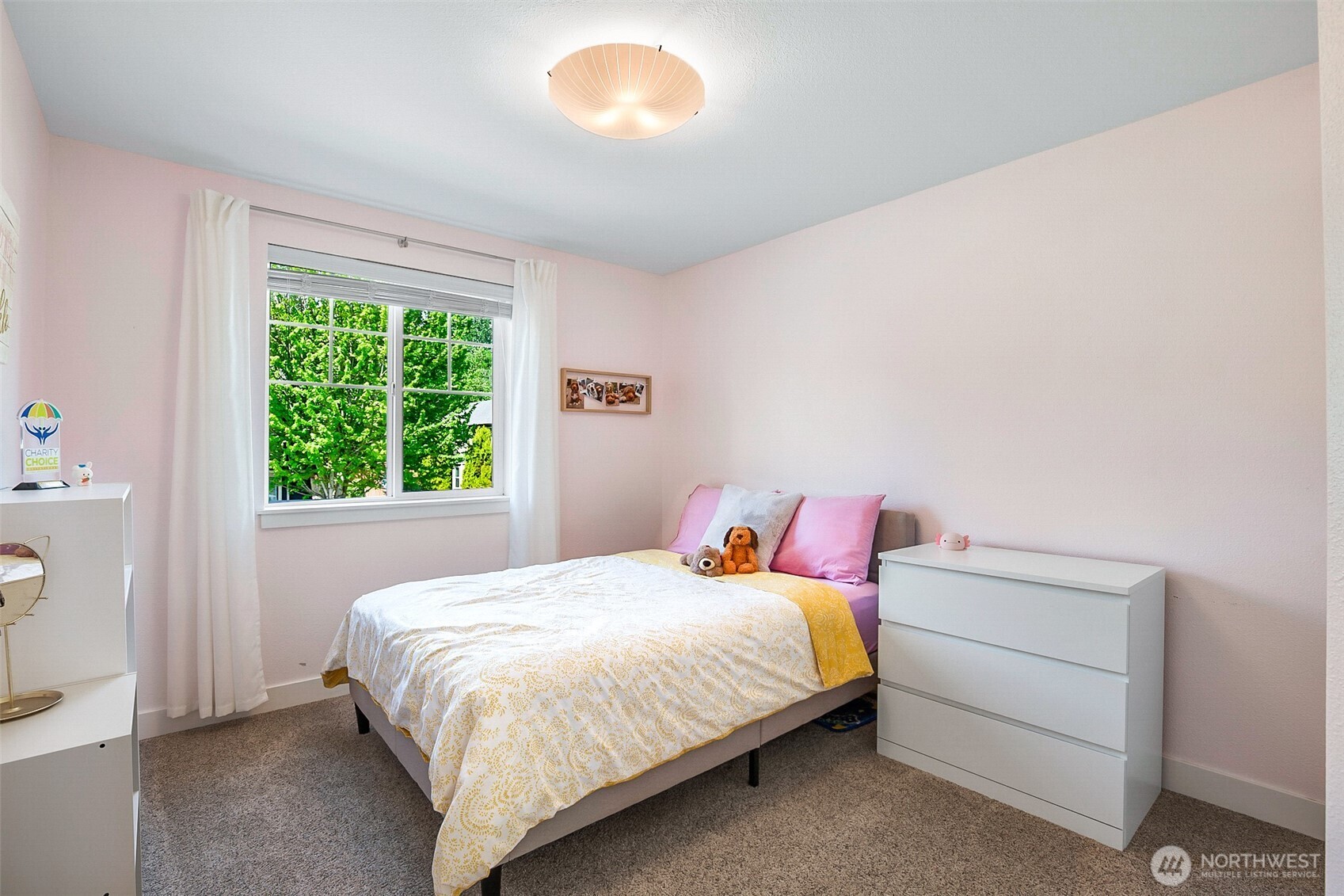 708 Rosario Place Northeast Renton, WA 98059 - Photo 29 of 38 a bedroom with a bed and a window