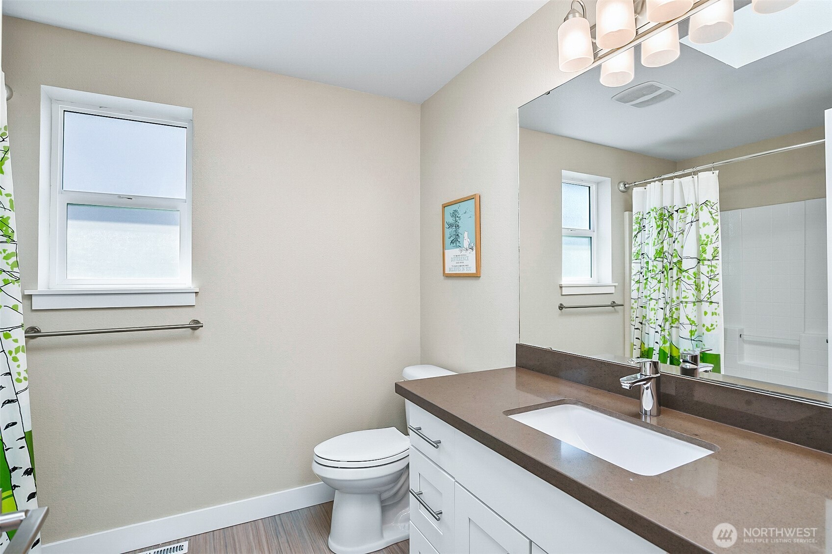 708 Rosario Place Northeast Renton, WA 98059 - Photo 30 of 38 a bathroom with a sink toilet and window