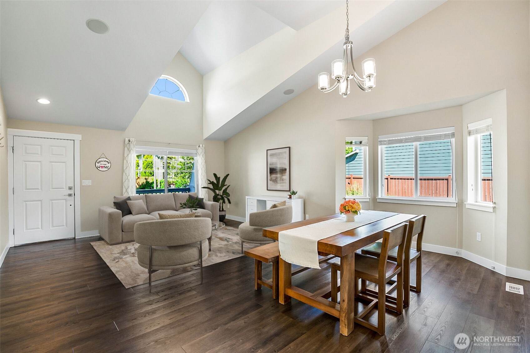708 Rosario Place Northeast Renton, WA 98059 - Photo 3 of 38 a view of a dining room with furniture window and wooden floor