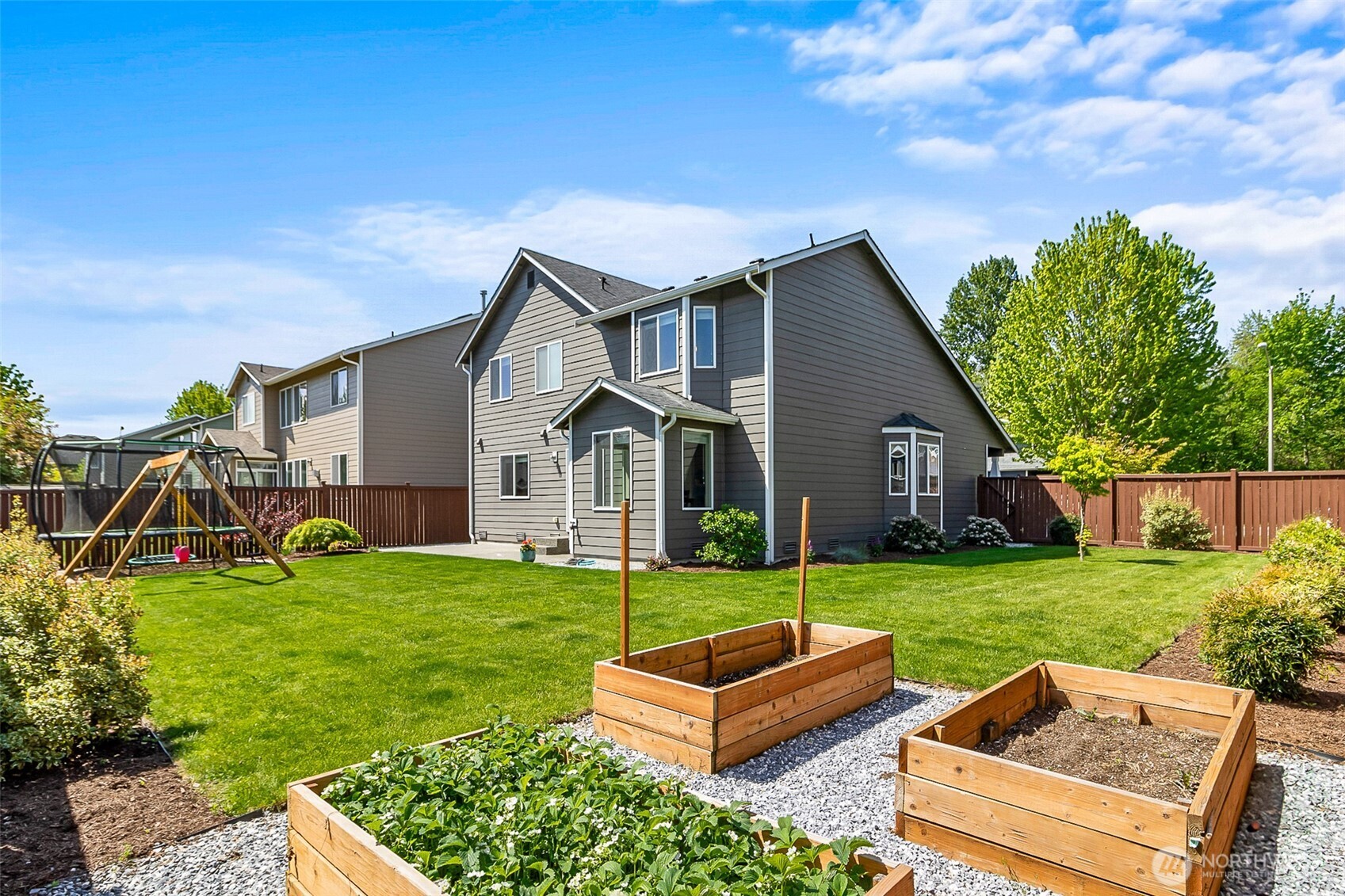708 Rosario Place Northeast Renton, WA 98059 - Photo 34 of 38 a view of a house with a yard