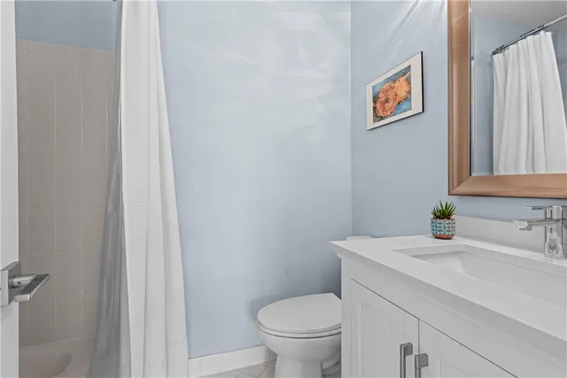 a bathroom with a toilet and a sink